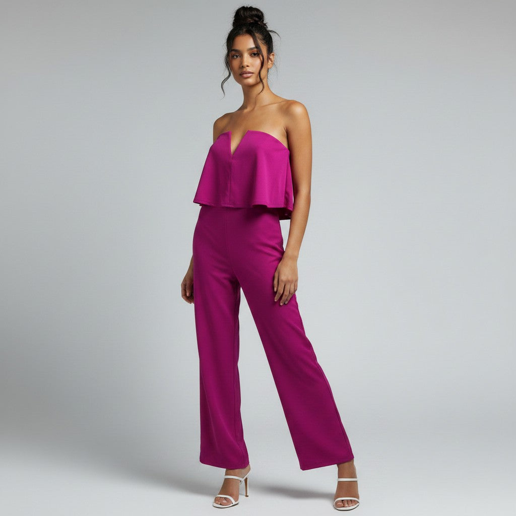 a woman in a pink romper on a white background