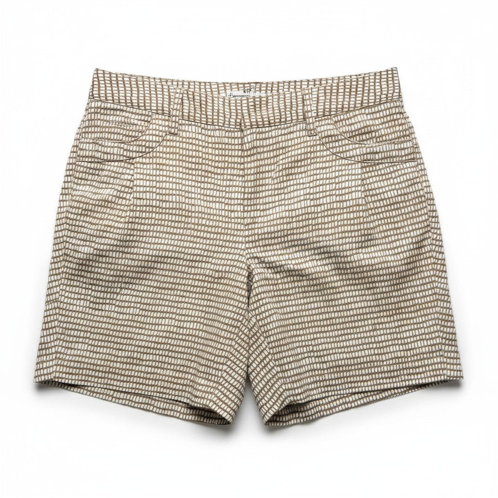 A pair of men's shorts featuring a fine, dense micro-pattern of beige and white horizontal lines, creating a textured, speckled appearance. The shorts are laid flat against a clean white background.