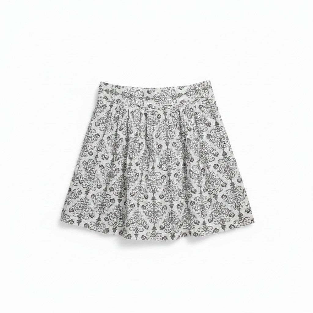 A short pleated skirt with an all-over gray and white damask pattern, shown flat against a plain white background.