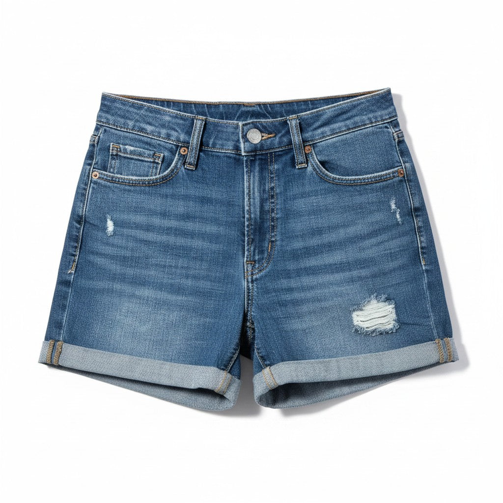 A pair of medium-wash blue denim shorts with a distressed, ripped design on the front, featuring rolled hems and a button closure, shown flat on a white background.