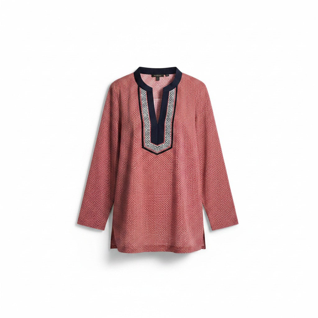 A long-sleeve tunic top in a dusty rose pink color with a small geometric pattern, featuring a contrasting dark navy blue V-neckline with a light blue and white embroidered border.