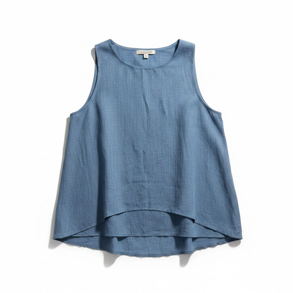A sleeveless high-low top in a dusty blue linen-like fabric, laid flat against a white background.