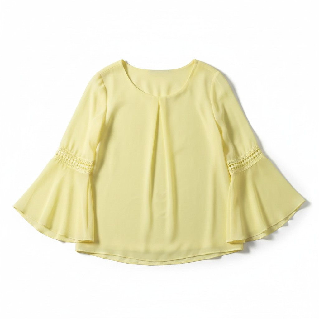 A pale yellow blouse with three-quarter bell sleeves, featuring a round neckline, a subtle center chest pleat, and delicate lace trim at the cuffs, shown against a plain white background.