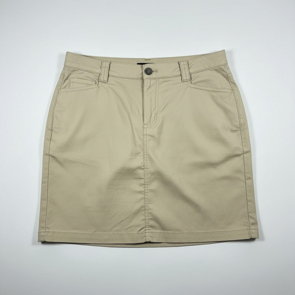 A beige mini skirt with a button closure, belt loops, and front pockets, laid flat on a light gray background.