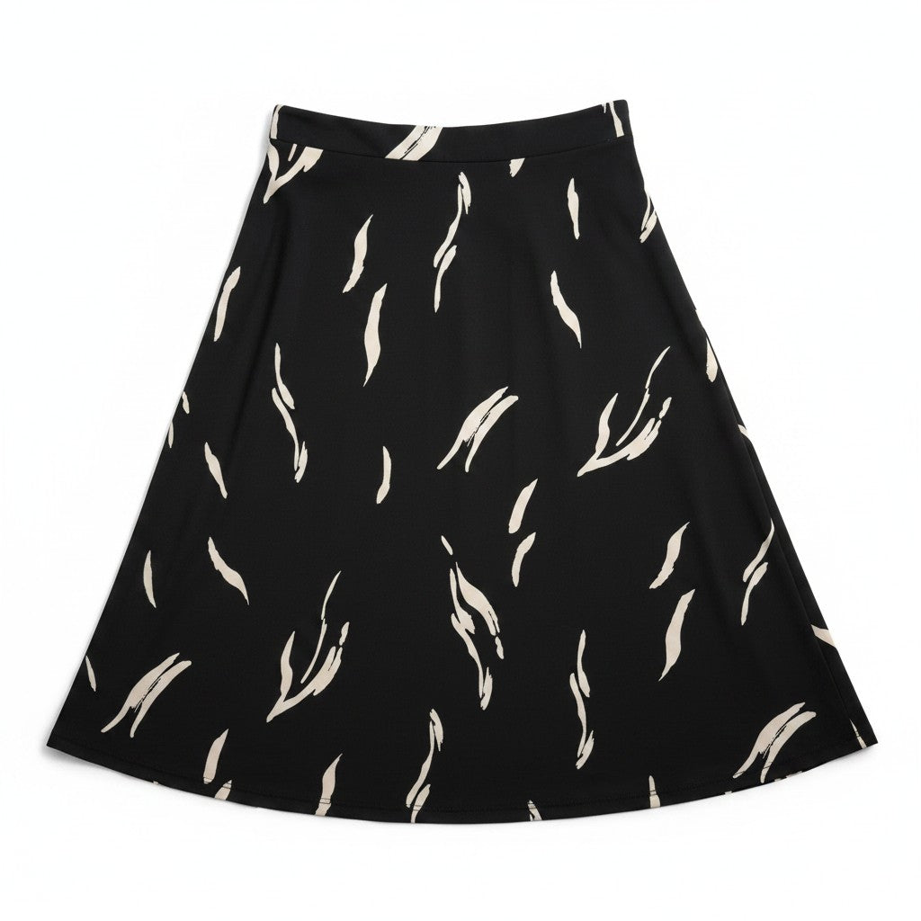 A black A-line skirt with an all-over abstract cream feather or leaf-like print, shown flat against a solid white background.