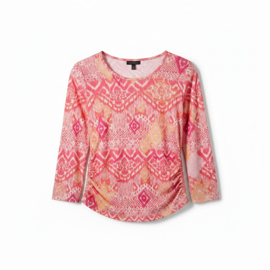 A women's long-sleeve top with a pink, orange, and yellow geometric ikat pattern, displayed flat against a white background.