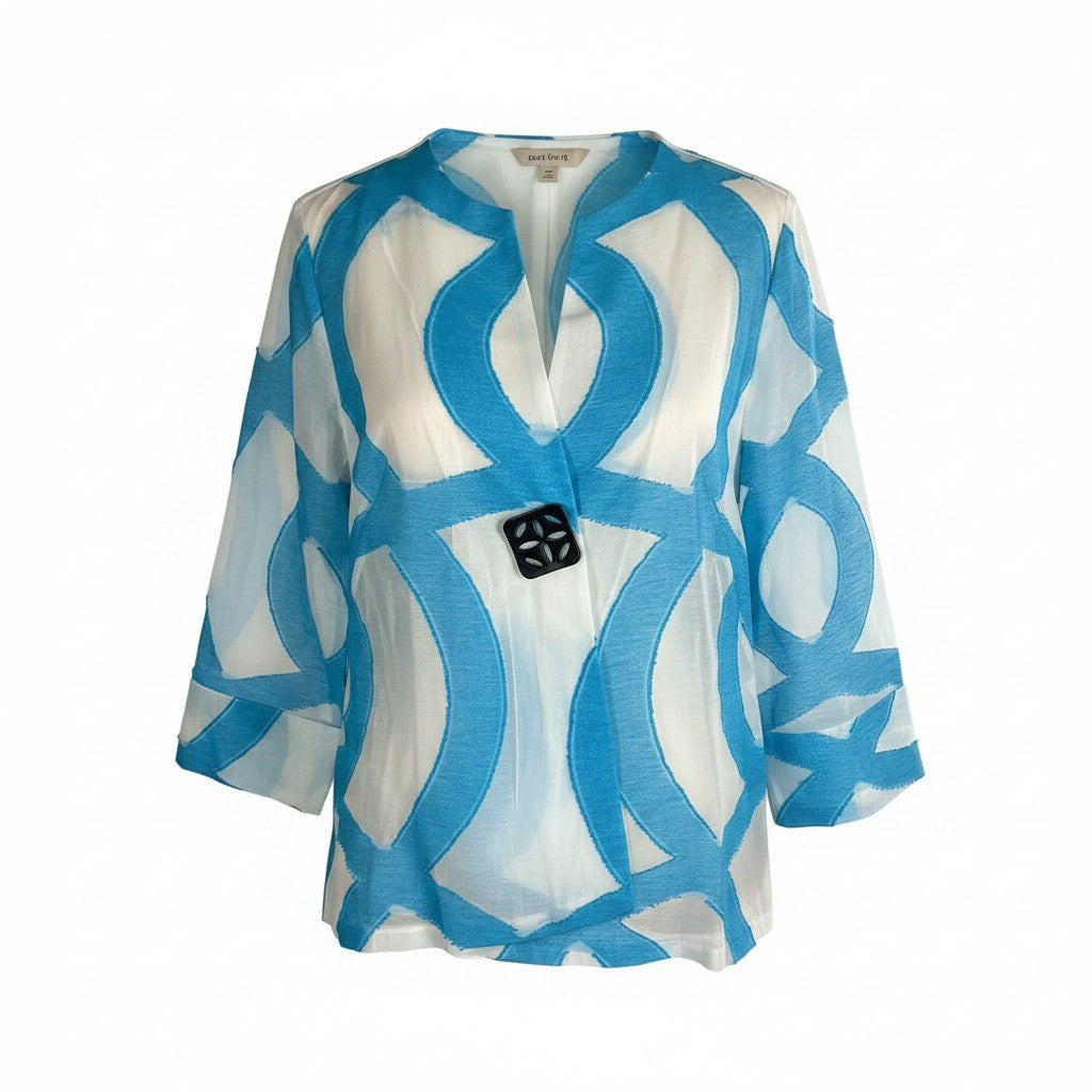 A lightweight white blouse with a bold blue abstract geometric pattern, featuring a split V-neckline and a black decorative button at the center front.