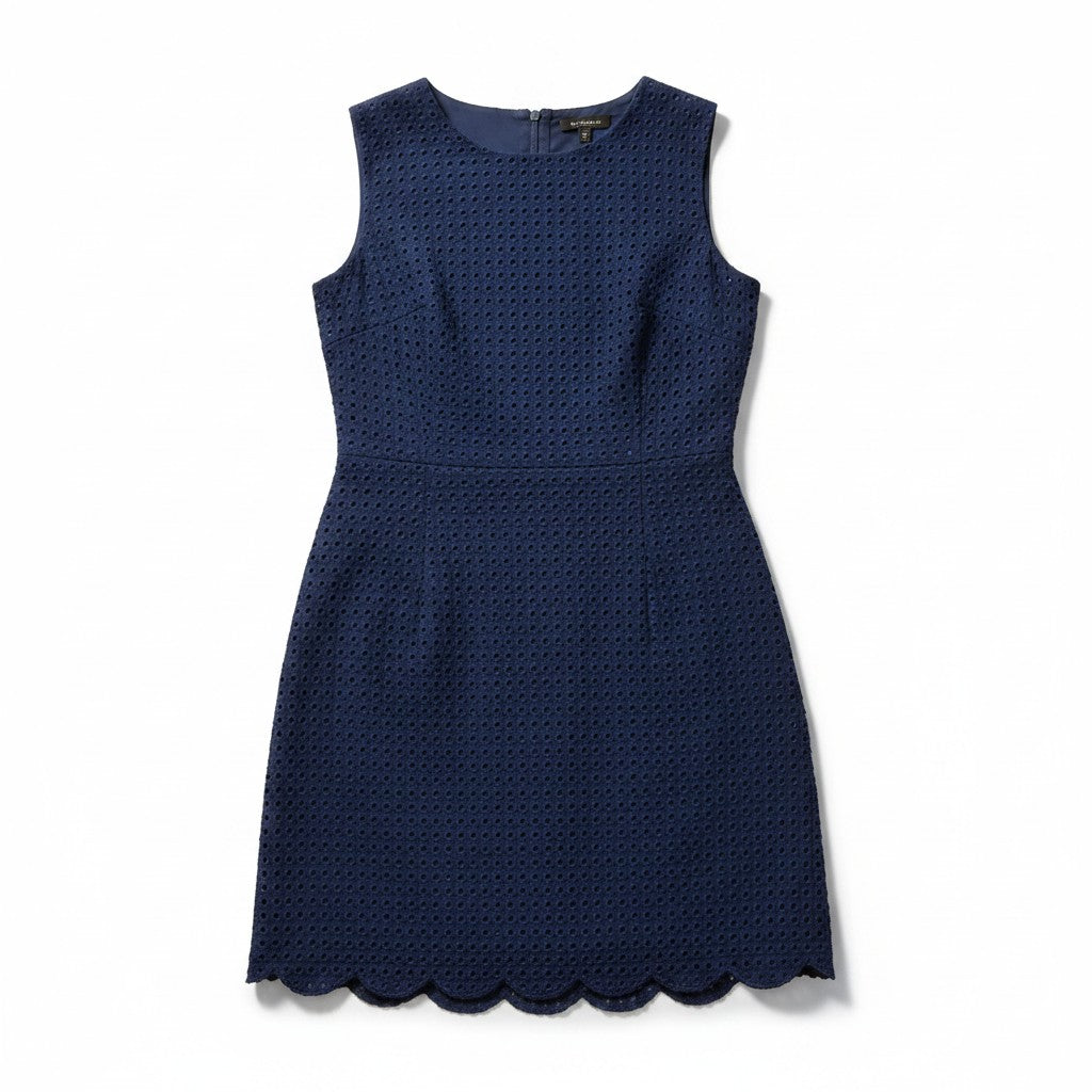 A sleeveless navy blue dress with a textured, perforated pattern and a scalloped hem, shown flat against a white background.