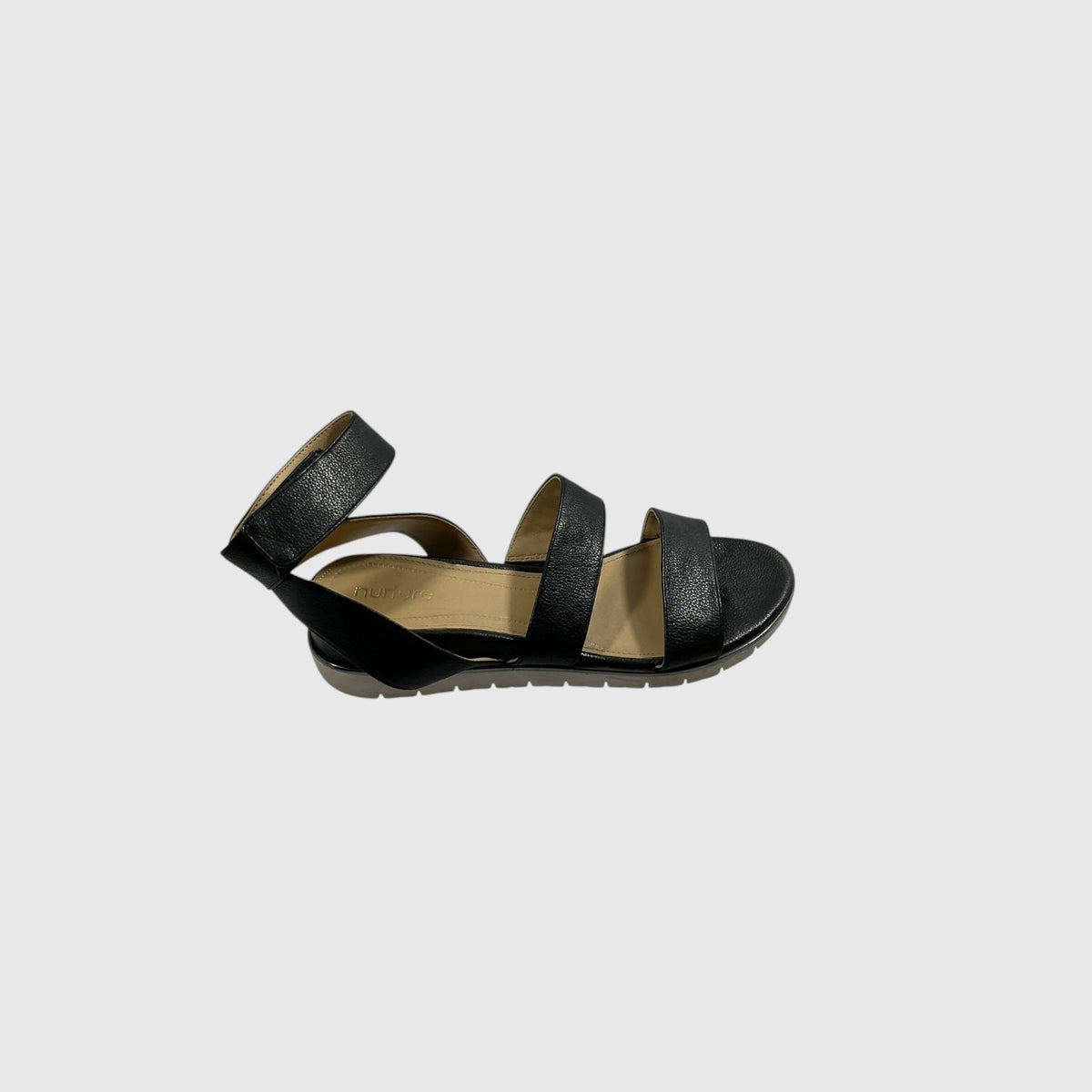 A single black leather sandal with an ankle strap and two toe straps, shown from a side profile view against a light gray background.