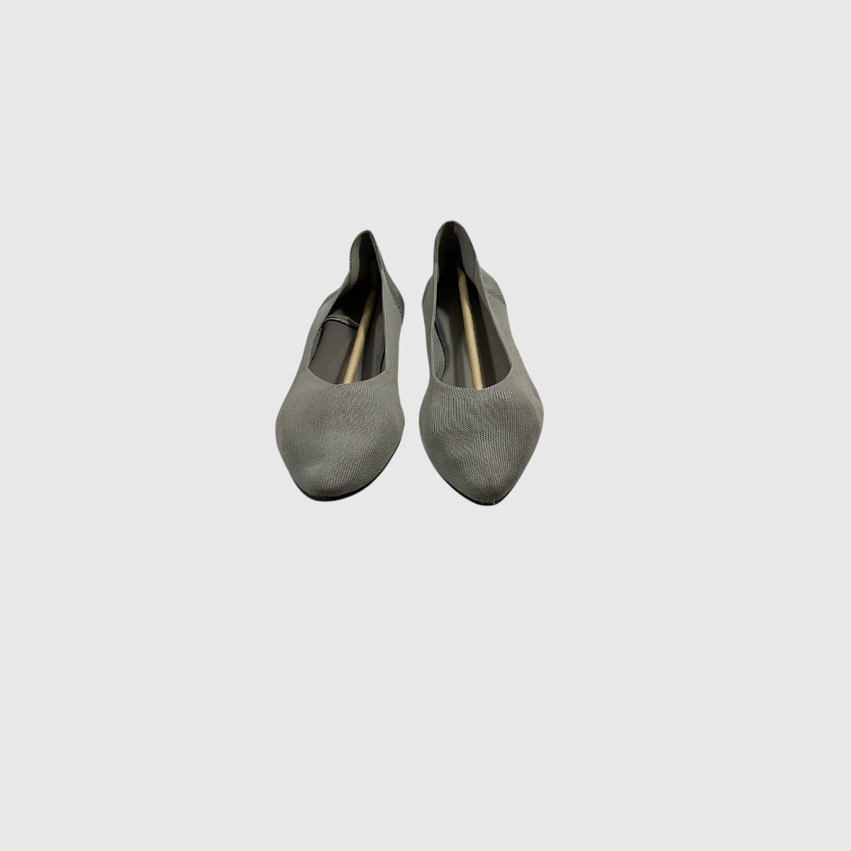A pair of women's pointed-toe flats in a textured gray leather, shown from a top-down view on a light gray background.