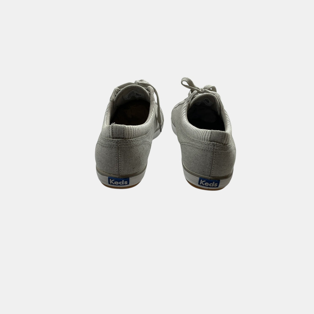 grey Keds sneakers on a white background