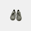 grey Keds sneakers on a white background
