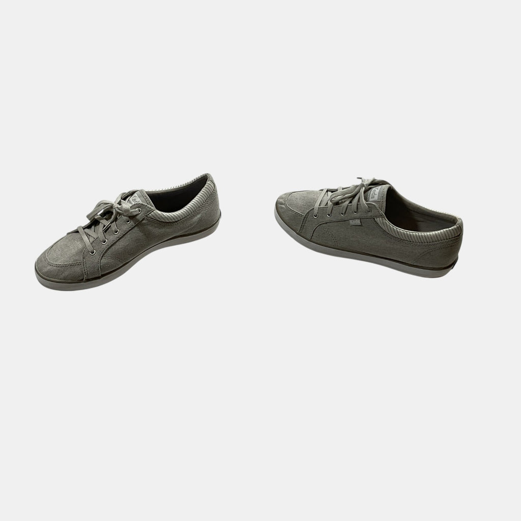 grey Keds sneakers on a white background