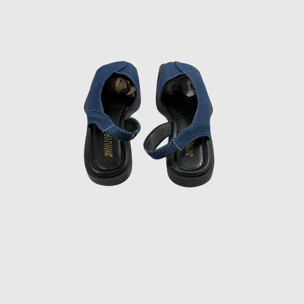 A pair of blue fabric thong sandals with black soles, shown from a top-down view on a light gray background.