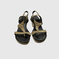A pair of women's platform sandals with metallic gold straps and a black footbed, shown from a top-down view on a light gray background.