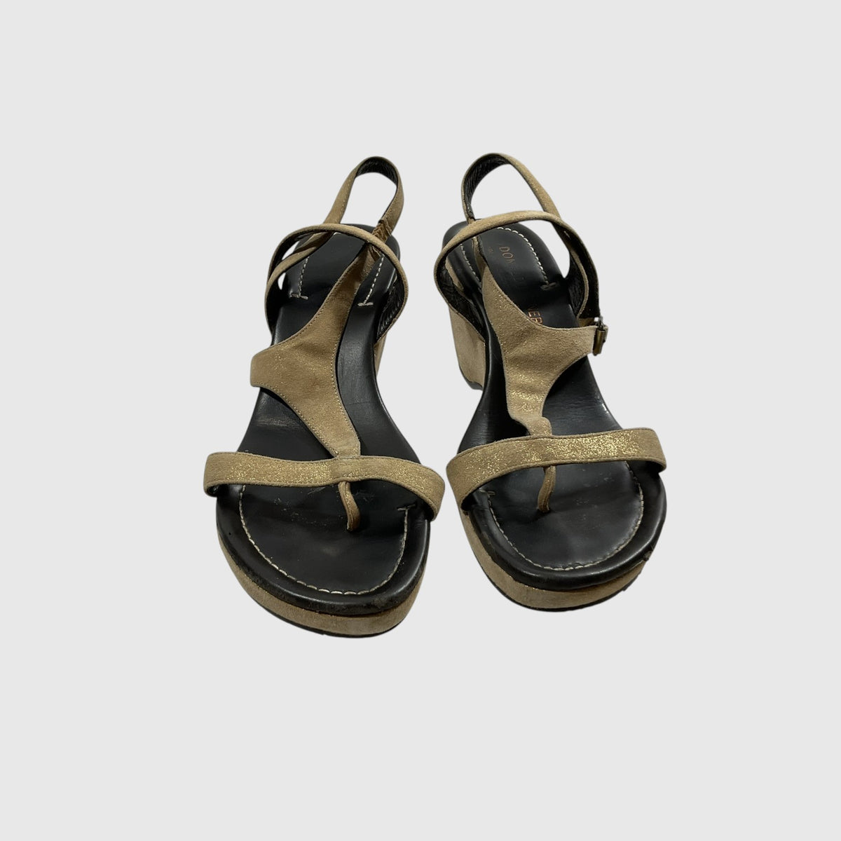 A pair of women's platform sandals with metallic gold straps and a black footbed, shown from a top-down view on a light gray background.