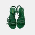 green sandal with rhinestones on a white background