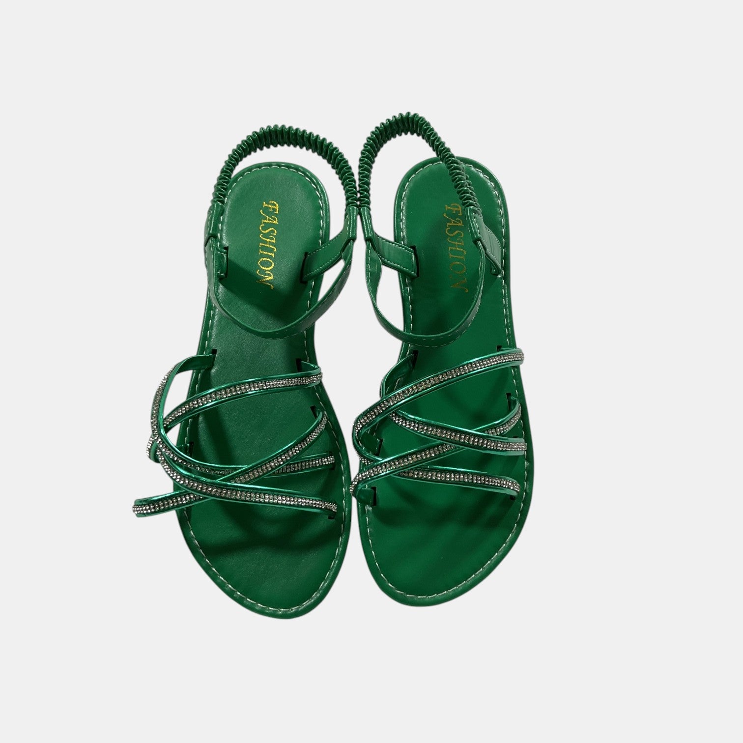 green sandal with rhinestones on a white background