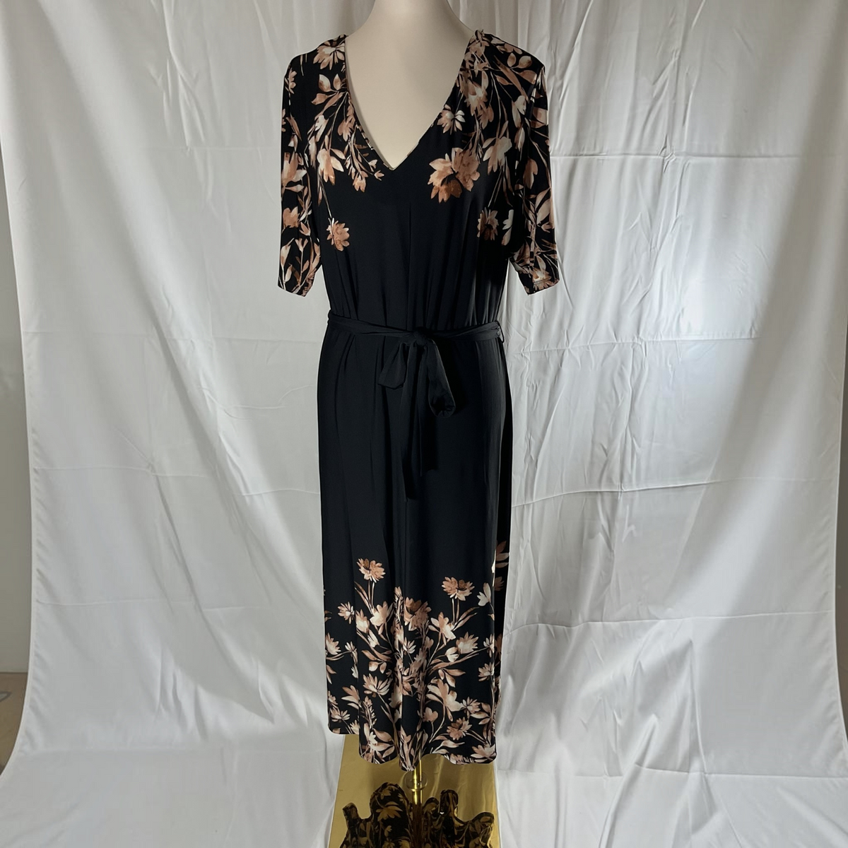 A black and floral dress on a light background