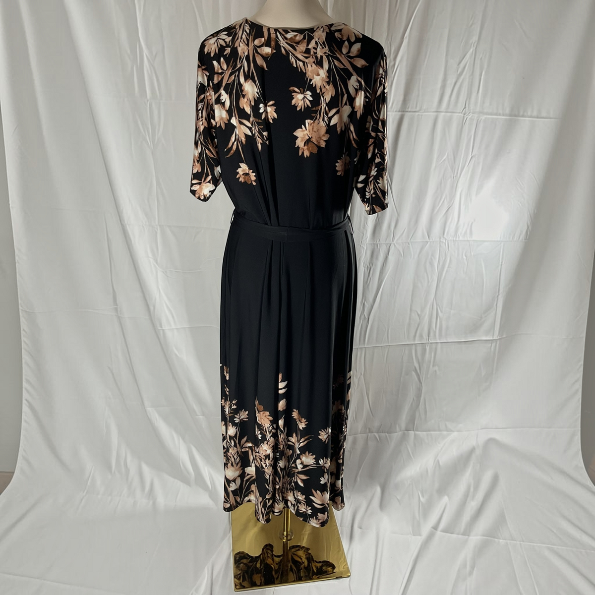 A black and floral dress on a light background