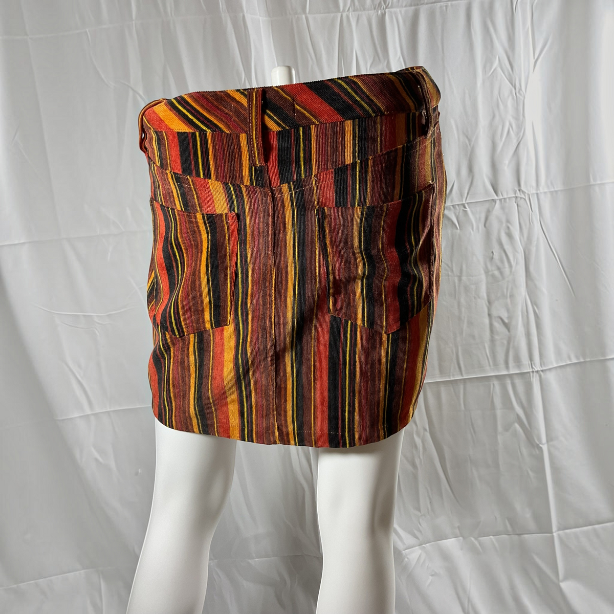 a strip skirt on a light gray background