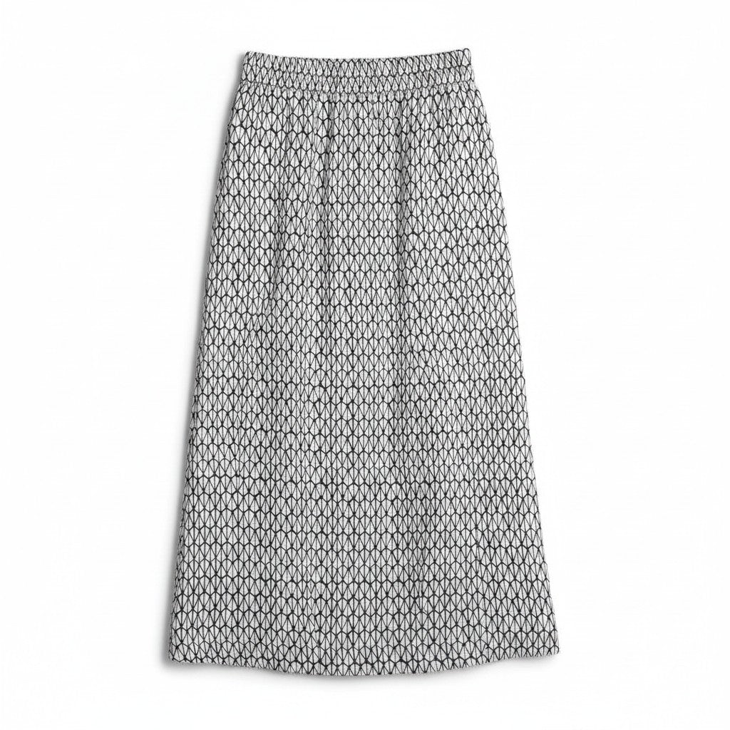 A pleated midi skirt with an all-over black geometric chain-link pattern on a white background, shown flat against a white backdrop.