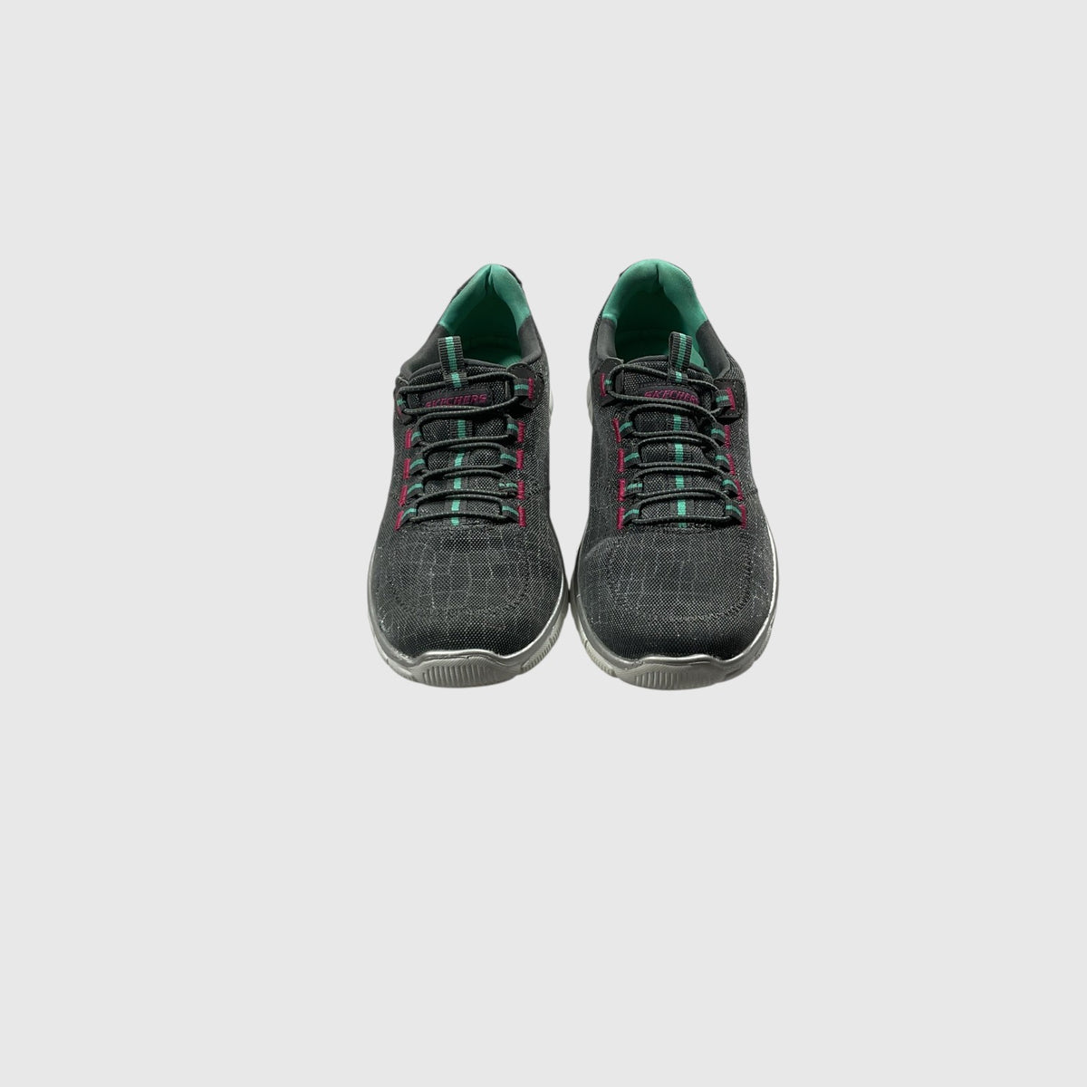 A gray, pink, and turquoise sneaker on a light gray background.