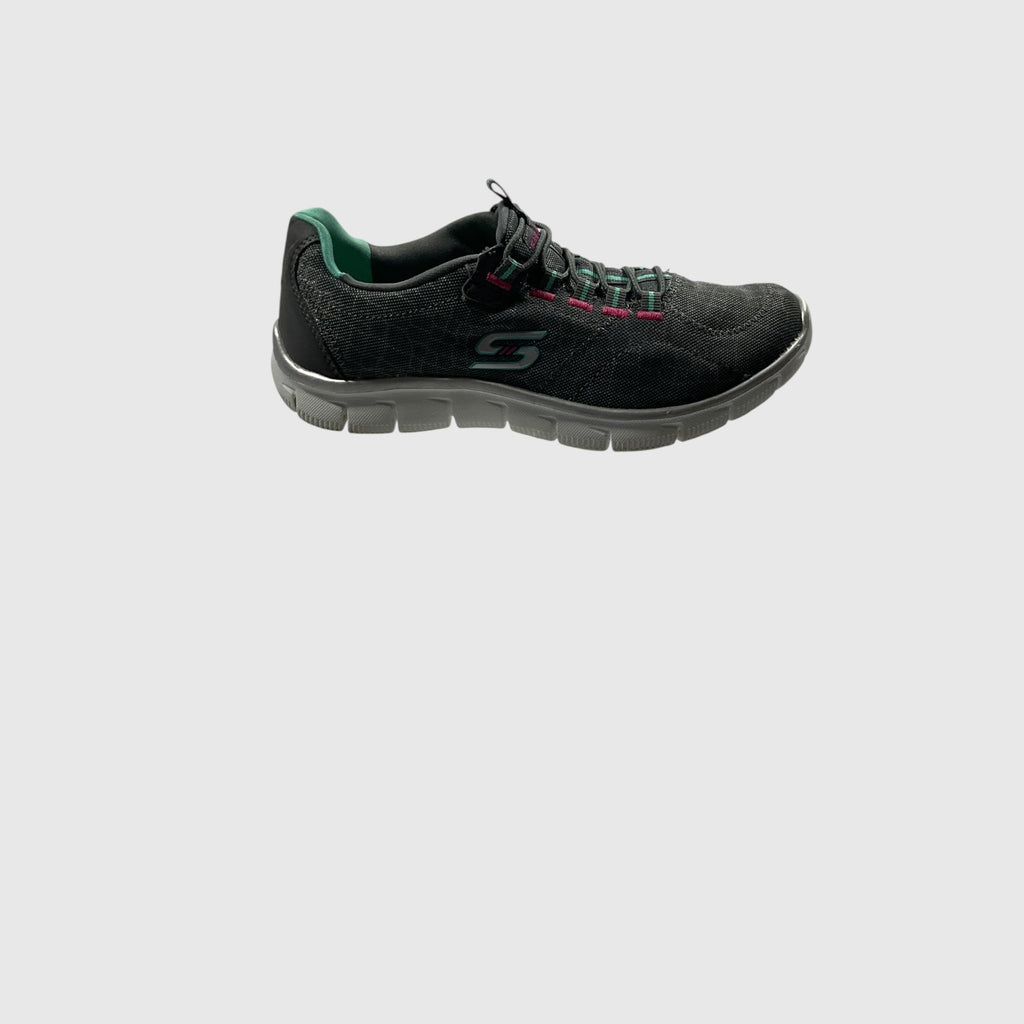 A gray, pink, and turquoise sneaker on a light gray background.