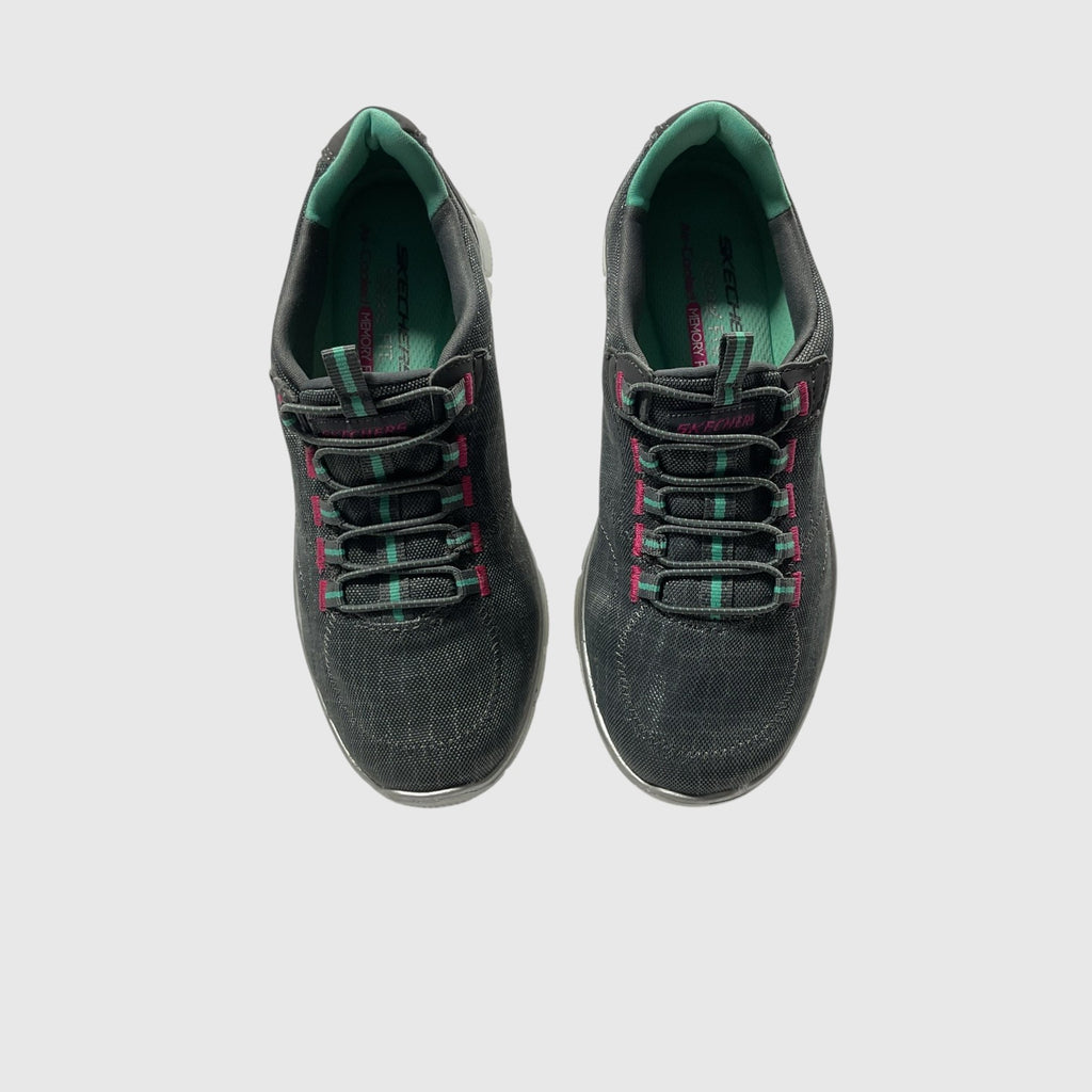 A gray, pink, and turquoise sneaker on a light gray background.