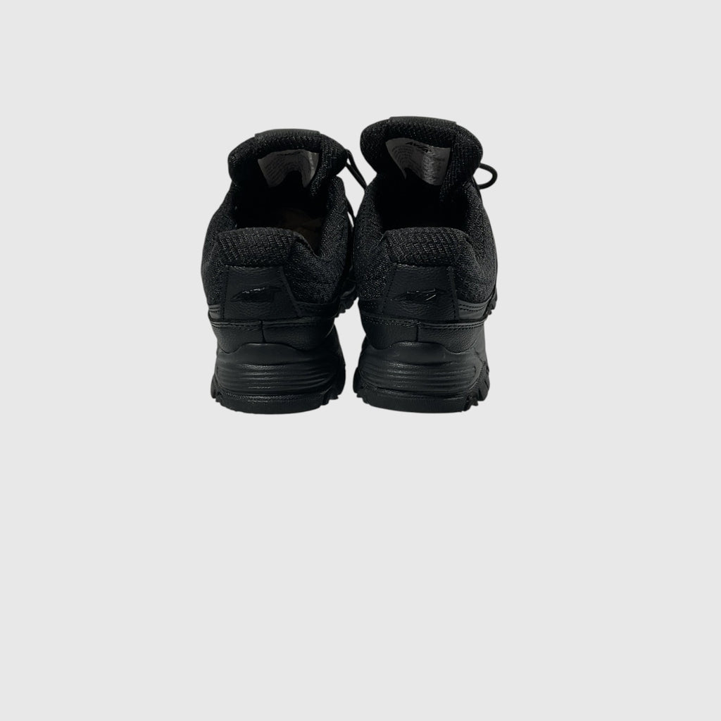A pair of black low-top lace-up shoe with a textured synthetic and mesh upper, black laces, and a rugged black sole, shown from a side profile on a light gray background.