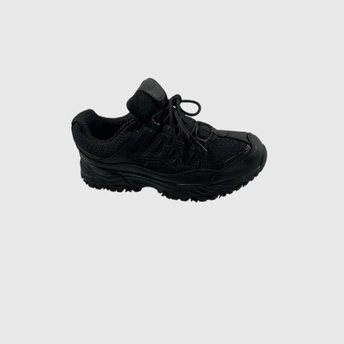 A black low-top lace-up shoe with a textured synthetic and mesh upper, black laces, and a rugged black sole, shown from a side profile on a light gray background.