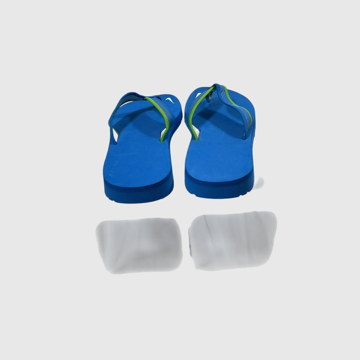 A pair of blue and green flip flops on a light gray background.