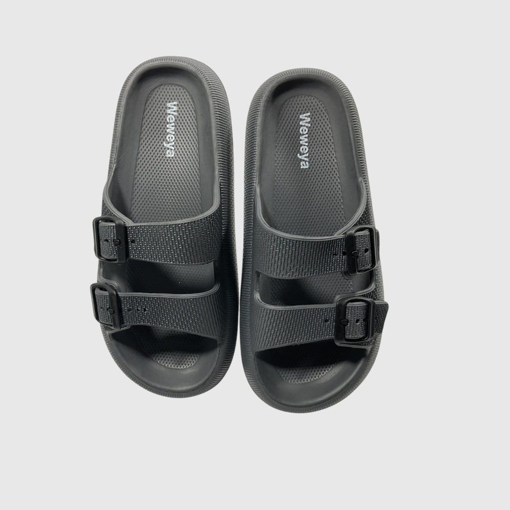 A pair of black slides on a light gray background.