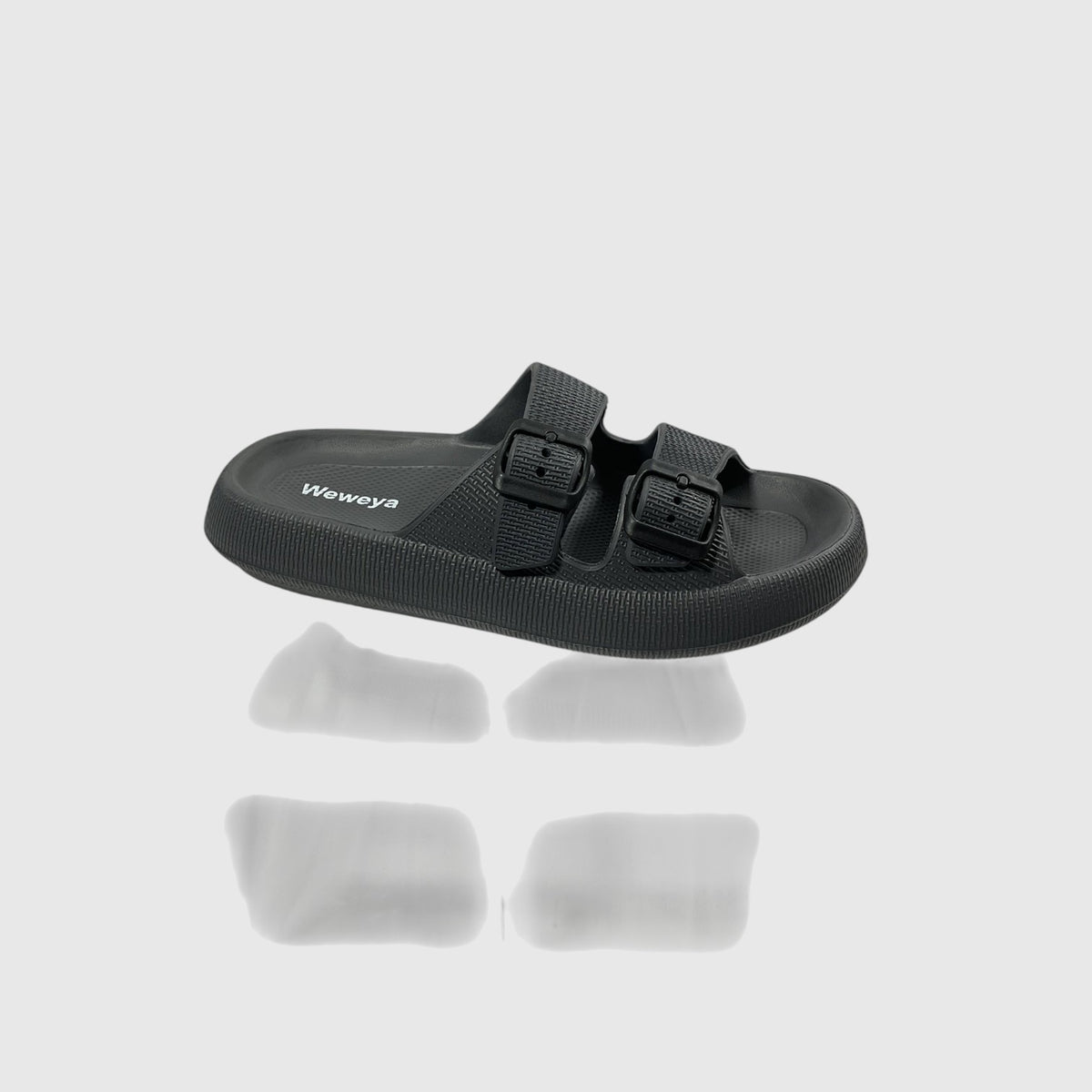 A pair of black slides on a light gray background.