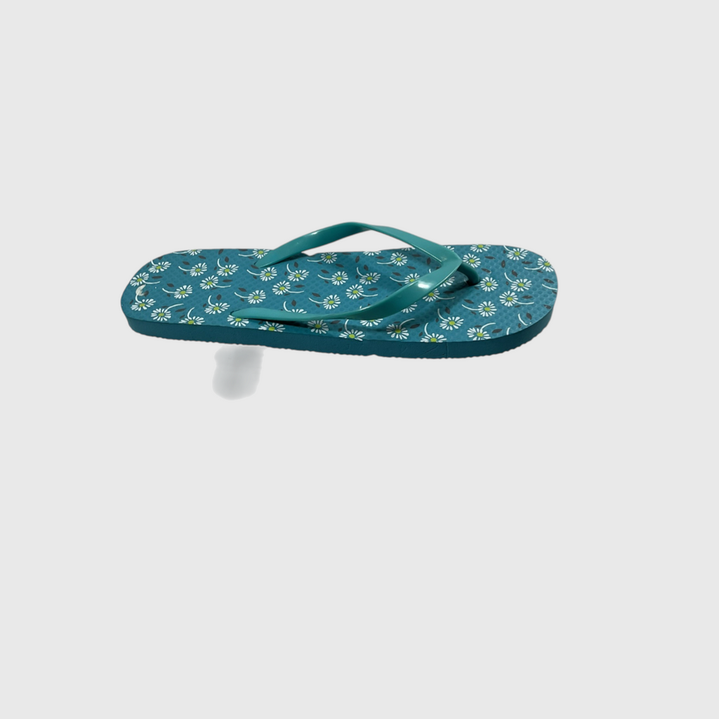 A single teal flip-flop sandal with a white floral pattern on the footbed, shown floating against a light gray background.