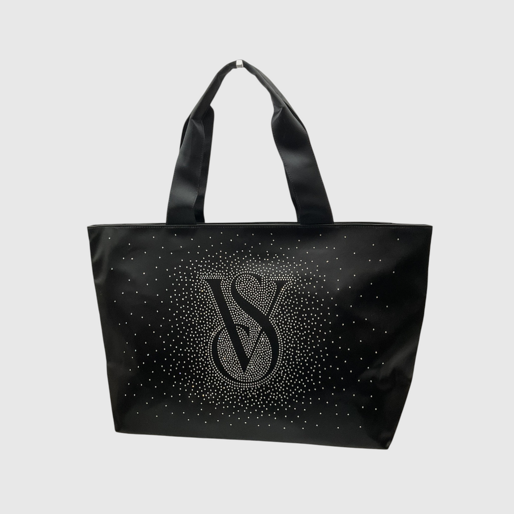 A black tote bag with a large rhinestone-embellished 'VS' monogram on the front, set against a light gray background.