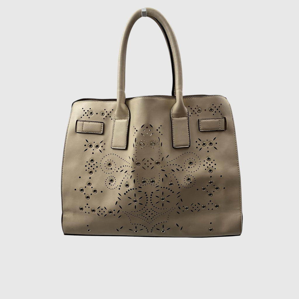 A taupe leather handbag with intricate laser-cut floral and geometric patterns on the front, featuring dual top handles and small front strap details, shown against a light gray background.