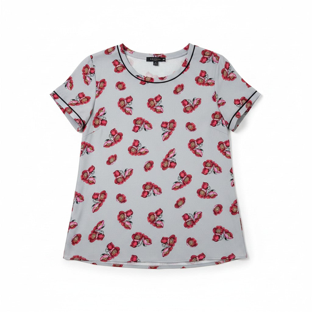 A light gray short-sleeve t-shirt with an all-over red and pink floral print, featuring black piping trim along the collar and sleeve cuffs, displayed flat against a white background.