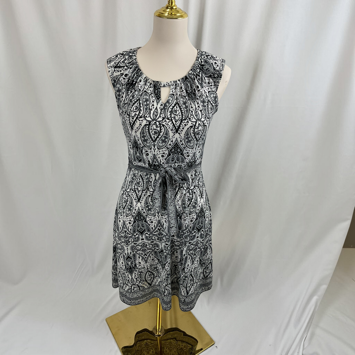 A floral sleeveless dress on a light gray background