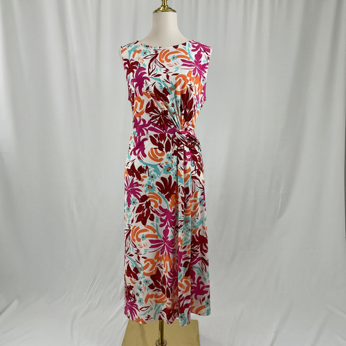 A sleeveless midi dress with a vibrant tropical floral print, displayed on a mannequin torso against a white fabric backdrop.