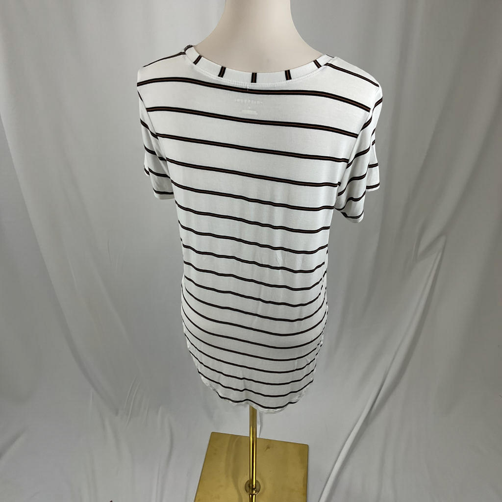 A white short-sleeve crewneck t-shirt with thin black horizontal stripes, displayed on a mannequin torso with a gold stand against a draped white fabric background.