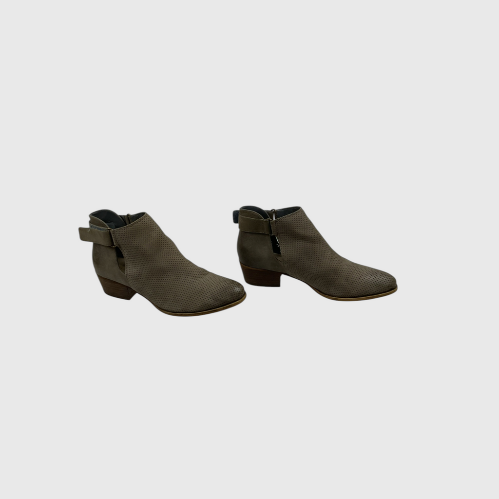A pair of women's ankle boots in a dark olive green color, featuring a textured finish, low block heels, and side buckle straps, shown against a plain light gray background.