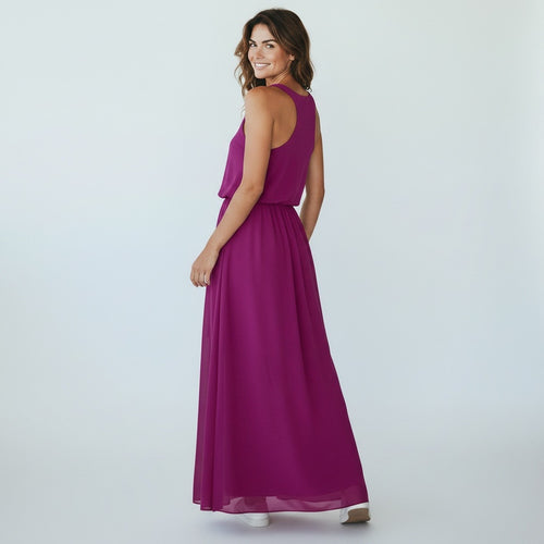 Woman wearing a long magenta dress on a white background